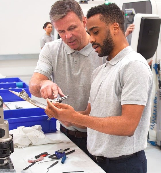 Engineers looking at components