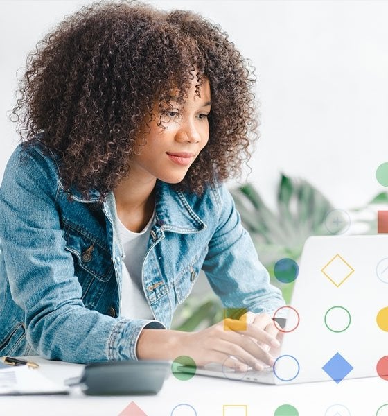 Woman working on laptop.