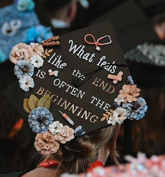 Mansfield Graduation cap with a message on top noting: "What feels like the end is often the beginning."