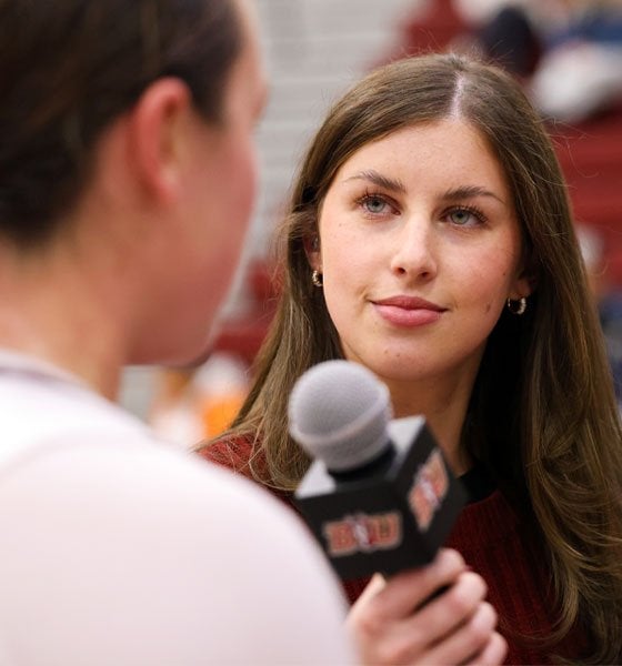 Media and Journalism major Addison Sondberg interviews a Bloomsburg basketball player