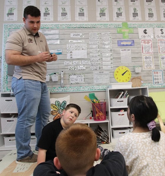 Bloomsburg student teacher instructs students in autism support classroom.