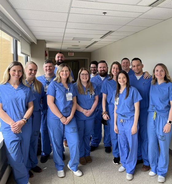 A group of Nurse Anesthetists standing together posing for a photo.