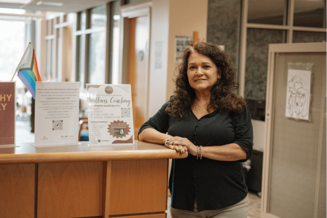 MSW student standing at a front desk