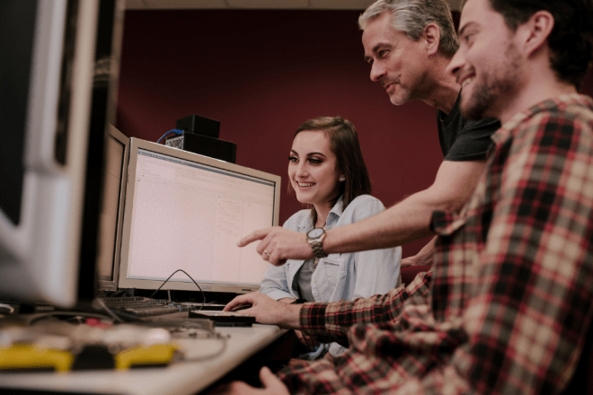 A faculty member instructs two Digital Forensics and Cybersecurity students at Commonwealth University - Bloomsburg