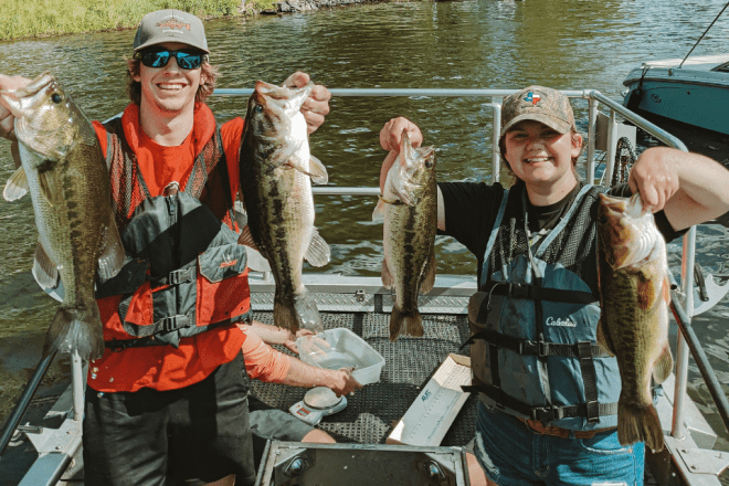 Two Fisheries and Aquatic Biology students at CU-Mansfield showing off their catches