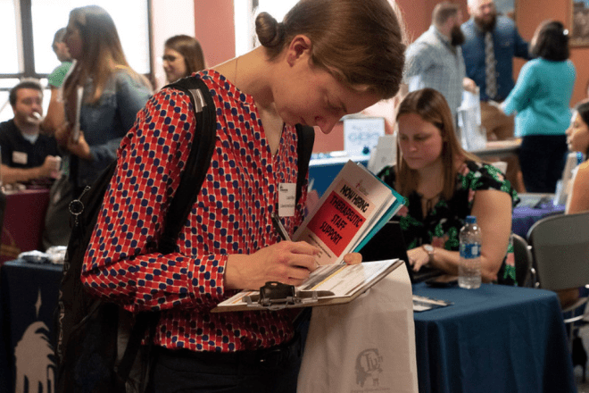 A student signs up for employer communication at a recent Career Connections Expo