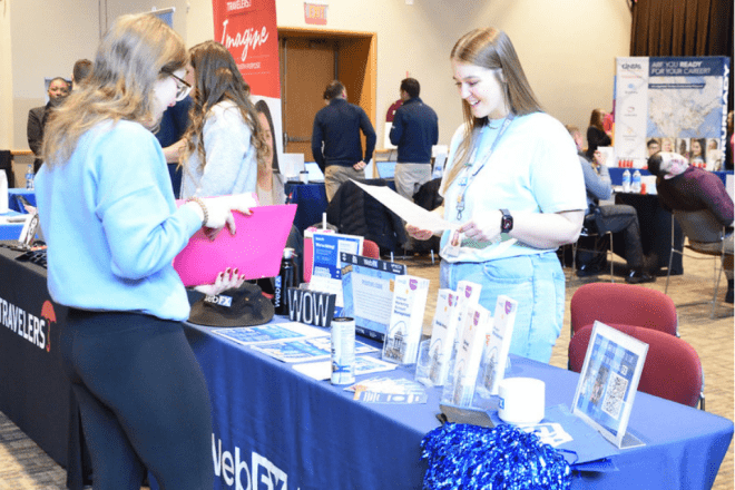 A recruiter from WebFX reviews a resume from a Communication Studies senior.