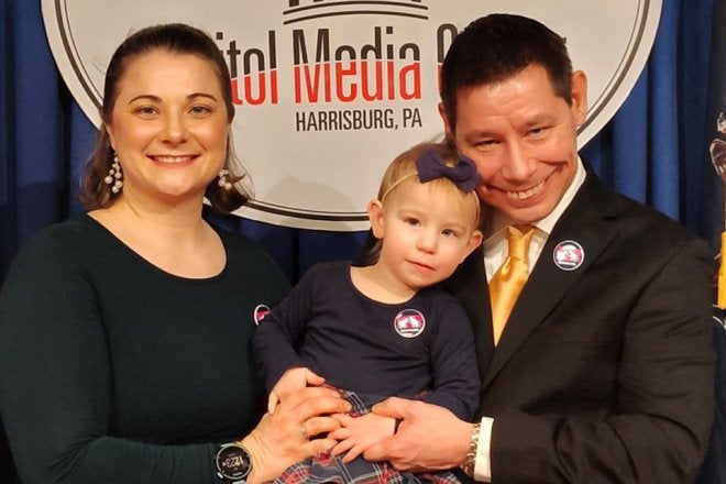 Elisabeth and Dan Heckert with their daughter.