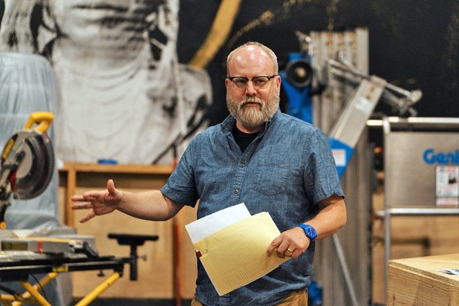 Professor David Miller directing a play.