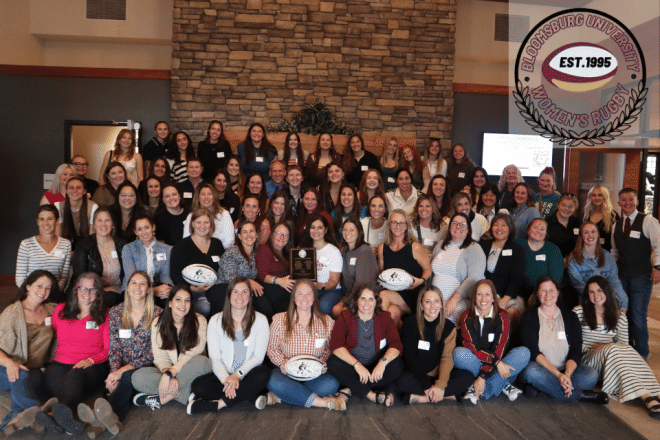 Members of the 2025 Women's Club Rugby alumni game pose for a photo.