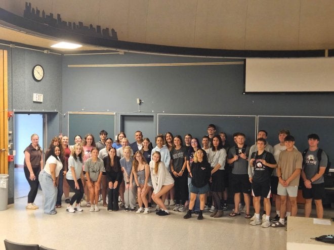 1993 Lock Haven alumnus Michael Watkins poses with TRIO SSS students in Ulmer Hall following an on-campus presentation on Sept. 10.