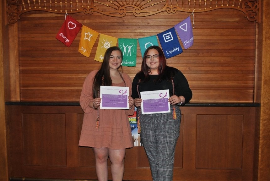 Two people standing together. 